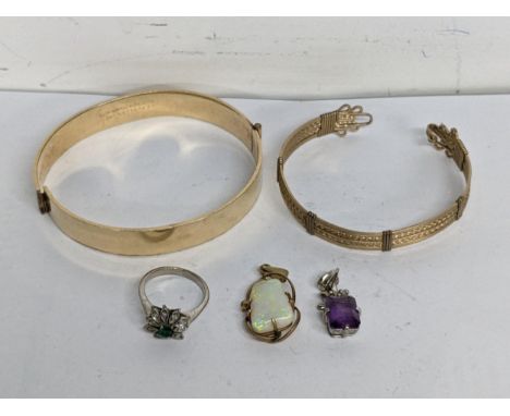 Jewellery to include an opal doublet in a 9ct gold frame, a silver pendant, a white gold ring and two gold plated braceletLoc