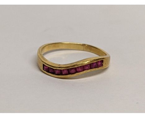 An 18ct ring inset with nine rubies, 2.7gLocation: 