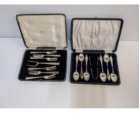 Silver comprising a set of six teaspoons and matching tongs, and a set of six cake forks and serving fork 237g Location: 