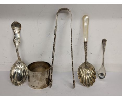 Mixed silver to include a napkin ring, sugar tongs and three spoons, total weight 117.1gLocation: 