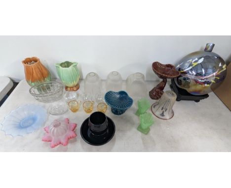 A mixed lot to include glass lamp shades, one pink example, ceramic vases and other mixed glassware and ceramics, along with 