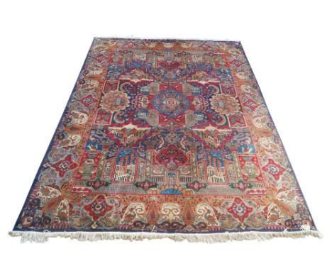 A Tabriz carpet, mid 20th century, with blue pole medallion, within a field composed of panels enclosing urns, animals, vases