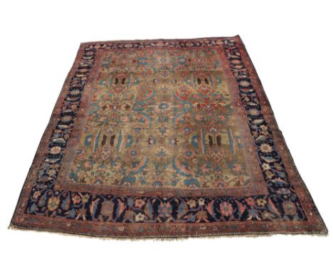 A Hamadan carpet, with all over design in biscuit coloured field, with indigo main border, flanked by red guard stripes, (pro