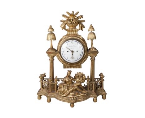 A large German gilt wood and gesso mantel clock, early 19th century, the base in the form of a balcony, with central figure g