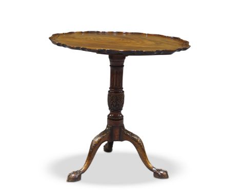A George III style mahogany tilt top occasional table, late 19th Century, the shaped pie crust top on fluted baluster support
