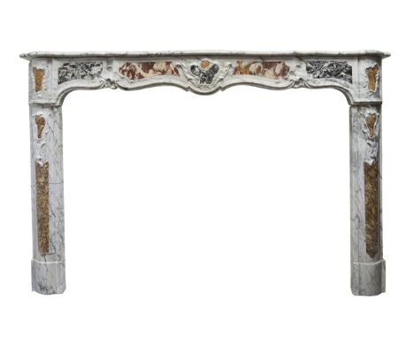 A large Louis XV style polychrome inlaid chimneypiece, in blue veined Carrara Giorgio Curva marble,  inlaid with shaped speci