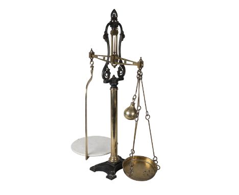 A pair of  Victorian brass and iron beam scales by WT Avery Ltd of Birmingham, the ceramic plate bearing a device for W & T A