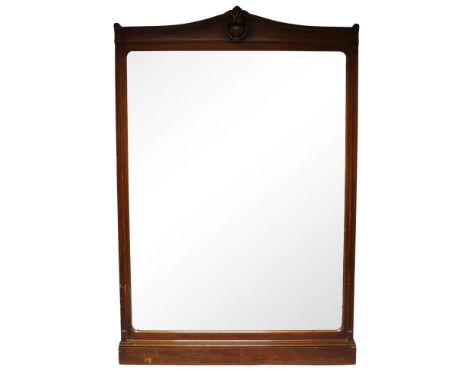 A large Victorian mahogany over mantel mirror, the curved top with vacant cartouche and wreath carved decoration, with step m