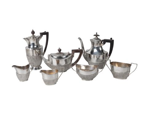 A silver harlequin bachelors three piece tea service, teapot and milk jug, London c.1900, sugar bowl Sheffield c.1900, all Wi