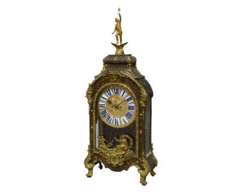 A large French gilt metal mounted eight day mantel clock, in the Louis XV style, 19th century, the case surmounted with a gil