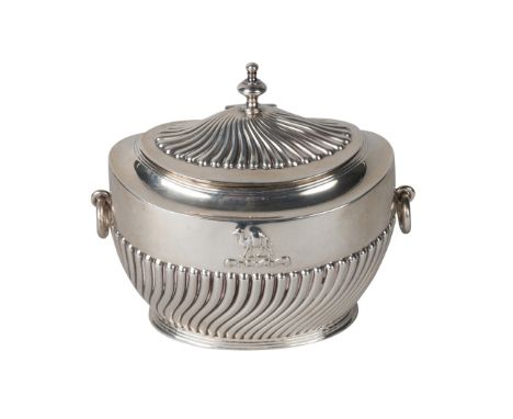 A silver oval tea caddy London c.1896, makers mark rubbed, with half gadrooned body and domed gadrooned hinged cover, with ca