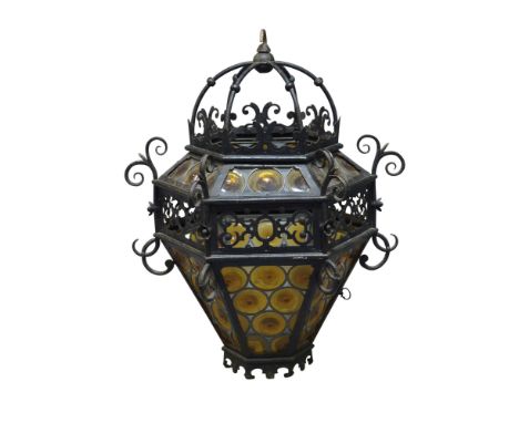 A Gothic taste hexagonal cast iron hall lantern, 19th century, with orange circular bulls eye pattern panels to the sides, 66