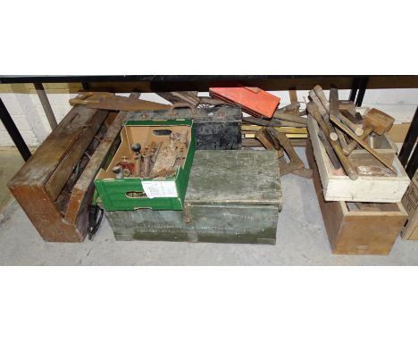 A large collection of various carpentry and other tools contained in wooden tool boxes, gardening tools, etc. 