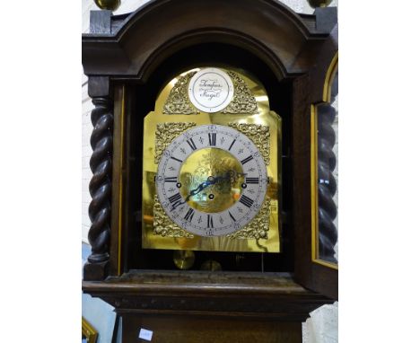 A modern chiming longcase clock, the oak case with brass arch dial and three-train movement striking on eight chimes, 237cm h