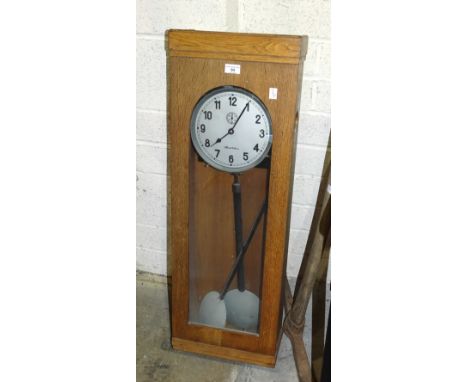 An oak-cased Chronotechna factory time clock, 93 x 32.5cm, a Benson chiming mantel clock, one other mantel clock and two mode