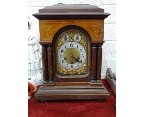 A late 19th century mahogany mantel clock, the brass dial with Arabic numerals, chime/silent and slow/fast subsidiaries, the 