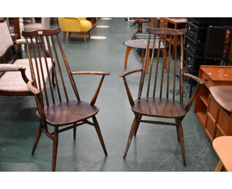 Pair of dark Ercol carver armchairs 