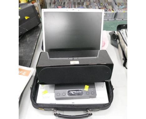 Vintage laptop in case and Sony Model SRS-GU10IP speaker system dock 