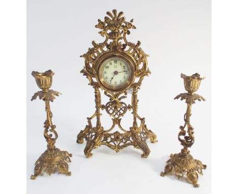 Miniature French brass clock garniture comprising mantel clock and pair of small candlesticks  - clock height 24cm tall