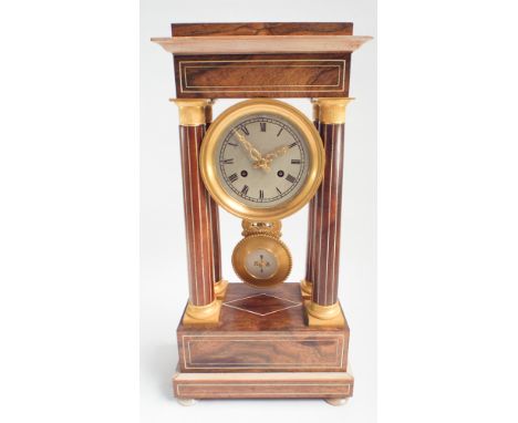French Empire style striking mantel clock in rosewood and gilt mounted case