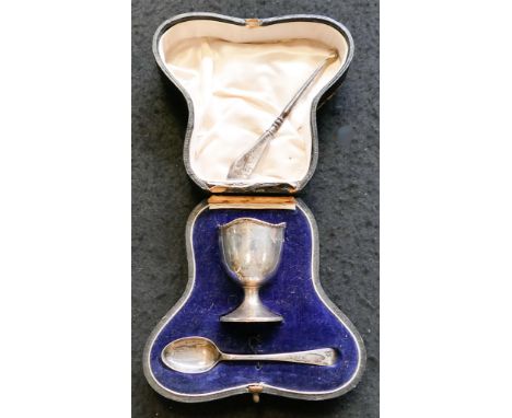 Hallmarked silver egg cup and spoon together with a silver handled button hook 