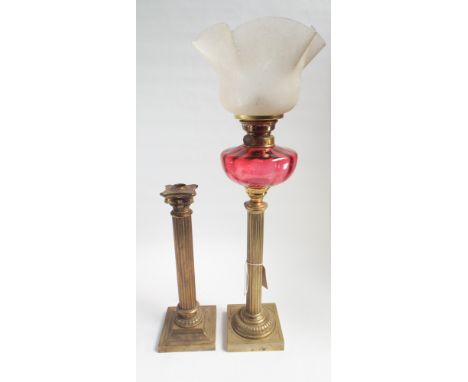 Victorian Corinthian column brass oil lamp with ruby glass bowl and decorative shade together with similar lamp stand 