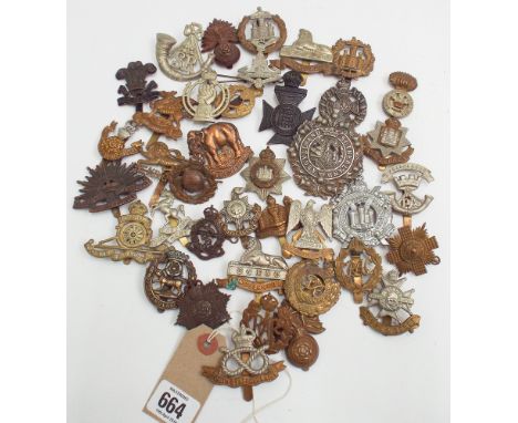 Approximately cap badges of the British Army to include the Argyle and Southern Highlanders, Devonshire Regiment, Royal Susse