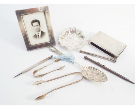 Collection of small silver ware to include easel photograph frame, leaf shaped dish, 1920's engine turned match case, berry s