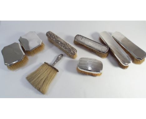 Selection of silver backed hairbrushes and a table top crumb sweep. (8 in the lot)