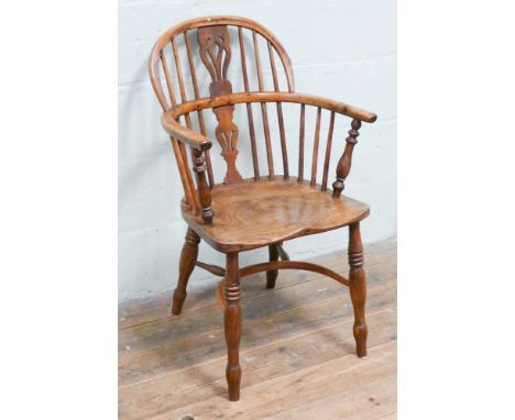 Antique yew wood tub shaped stick back Windsor elbow chair