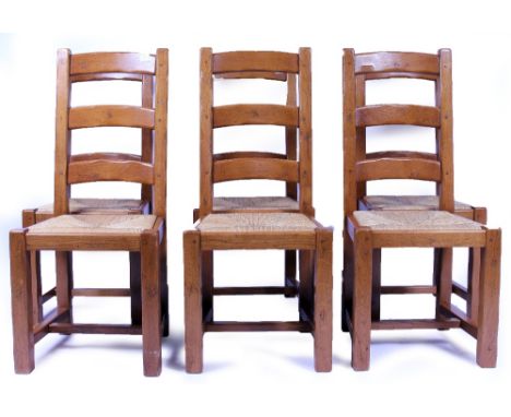 A SET OF SIX OAK LADDER BACK KITCHEN CHAIRS with inset rush upholstered seats (6)