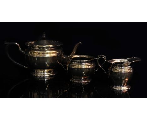 A SILVER PART BACHELORS TEA SET to include teapot, sucrier and milk jug, teapot with ebonised handle with marks for Birmingha