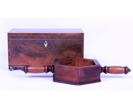 A LATE 18TH / EARLY 19TH CENTURY MAHOGANY LINE INLAID TEA CADDY standing on brass bun feet with ivory lozenge escutcheon and 