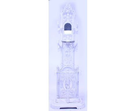 A WHITE PAINTED WROUGHT IRON COAT AND STICK STAND with later added mirrored panel with twin segment base 176cm high overall x