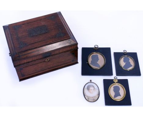 A REGENCY ROSEWOOD AND BRASS INLAID WORKBOX 28cm wide together with three Victorian silhouette portraits in ebonised frames a