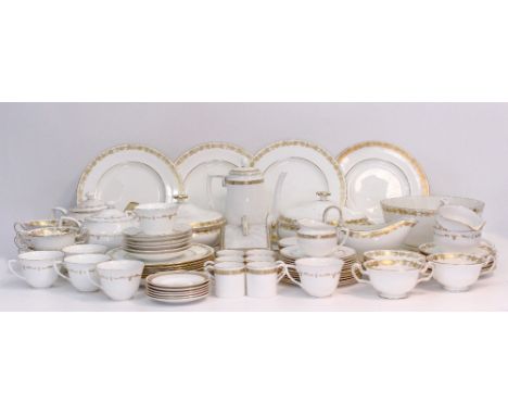 A WEDGWOOD PORCELAIN PART DINNER SERVICE decorated with gilt bands of trailing fruiting vine together with a Royal Worcester 