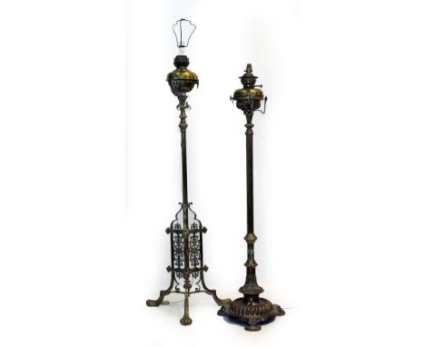 TWO 20TH CENTURY BRASS LAMP STANDARDS to include one in the Georgian style, the tallest measures 154cm, the other 141cm (both