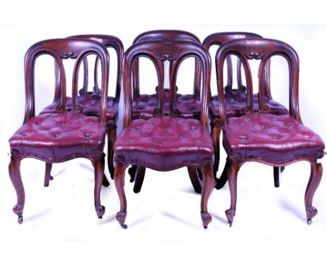 A SET OF EARLY VICTORIAN MAHOGANY DINING CHAIRS with red leather button upholstered seats and cabriole legs, terminating in c