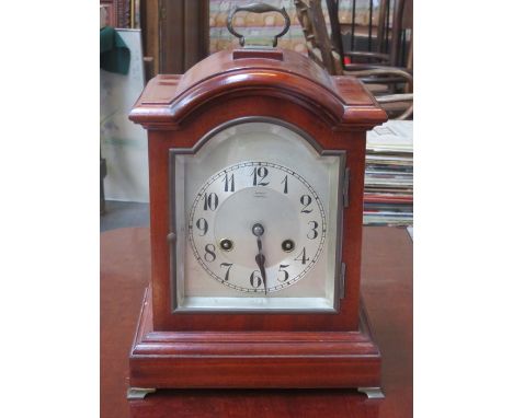 JUNGHAMS MAHOGANY CASED BRACKET CLOCK WITH SILVER COLOURED DIAL 