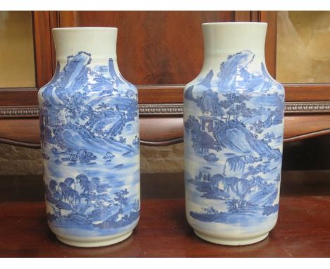 PAIR OF ORIENTAL BLUE AND WHITE GLAZED CERAMIC VASES DEPICTING VILLAGE SCENES, APPROXIMATELY 35cm HIGH 