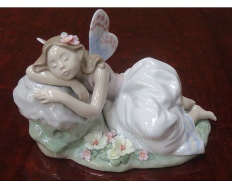LLADRO PRIVILEGE GLAZED CERAMIC FIGURE OF A RECLINING FAIRY, No 7694