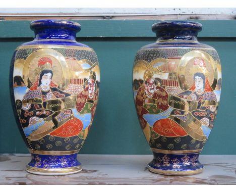 PAIR OF HEAVILY GILDED JAPANESE CERAMIC VASES SET WITH VARIOUS ORIENTAL FIGURES, APPROXIMATELY 30cm HIGH 