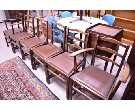 A set of six (four plus two) early 20th Century oak ladder back dining chairs