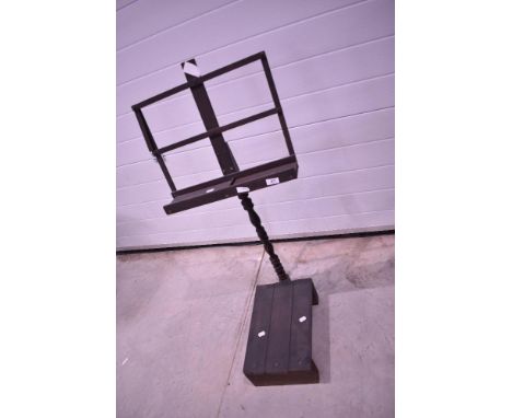A 19th Century rustic music stand with step to base