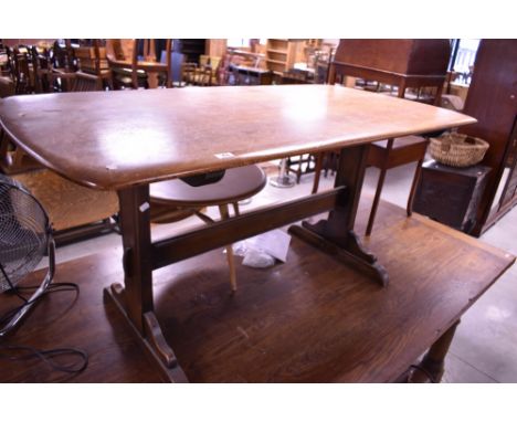 A dark stain Ercol refectory style dining table, approx. 153 x 76cm