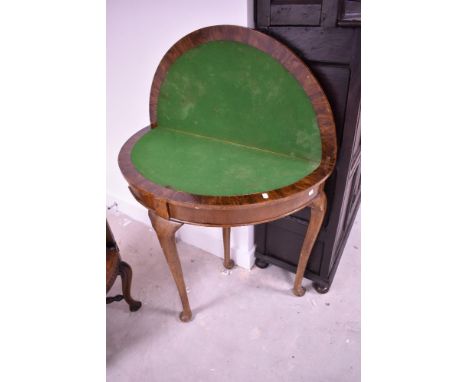 An early 20th Century walnut fold over card table in the Queen Anne style, width approx. 91cm
