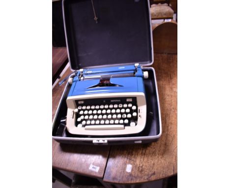 A vintage typewriter, Imperial Safari model, with case