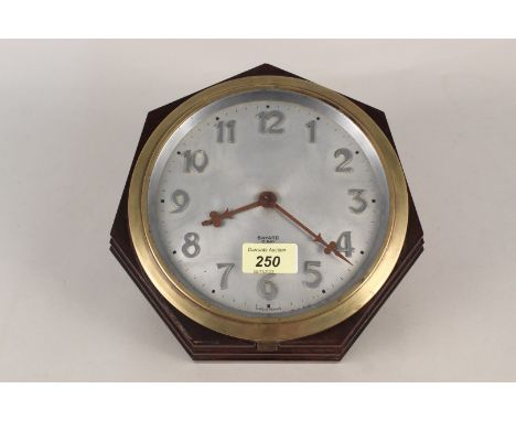 A 1930's French Bayard, eight day wall clock in a Bakelite case with brass bezel