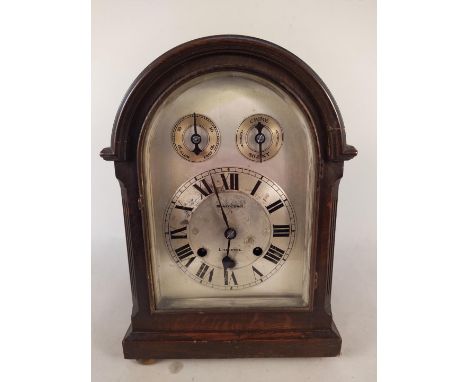 A Georgian style oak cased bracket clock with silvered dial, with striking, chiming 8 day movement by Morrth Bros Liverpool, 