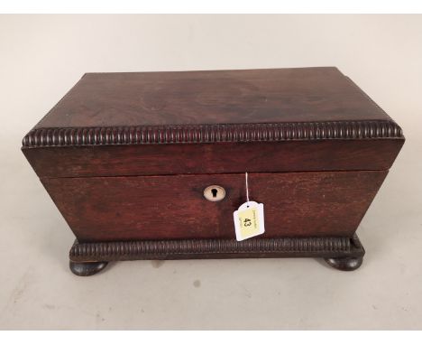 An early 19th Century rosewood sarcophagus double tea caddy with two separate lift out tea containers, mother of pearl escutc